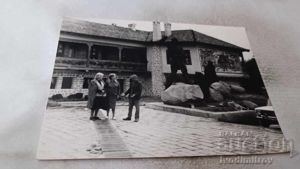Photo of a Man and Two Women in Front of a Museum Complex Photo of a Man and Two Women in Front of a Museum Complex