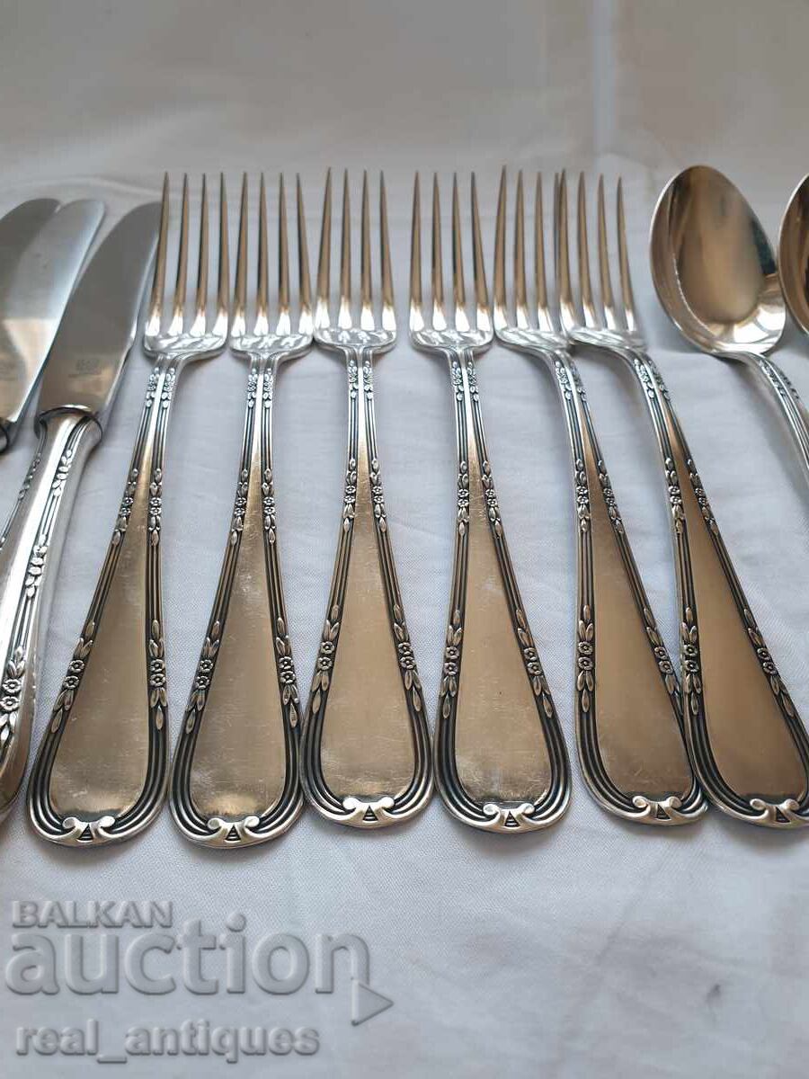 Auction Set of silver plated utensils Auction Set of silver plated utensils