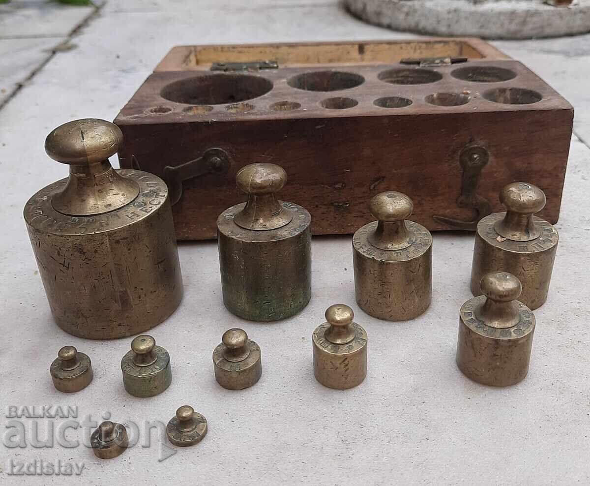 Set of old bronze weights in a wooden box Set of old bronze weights in a wooden box