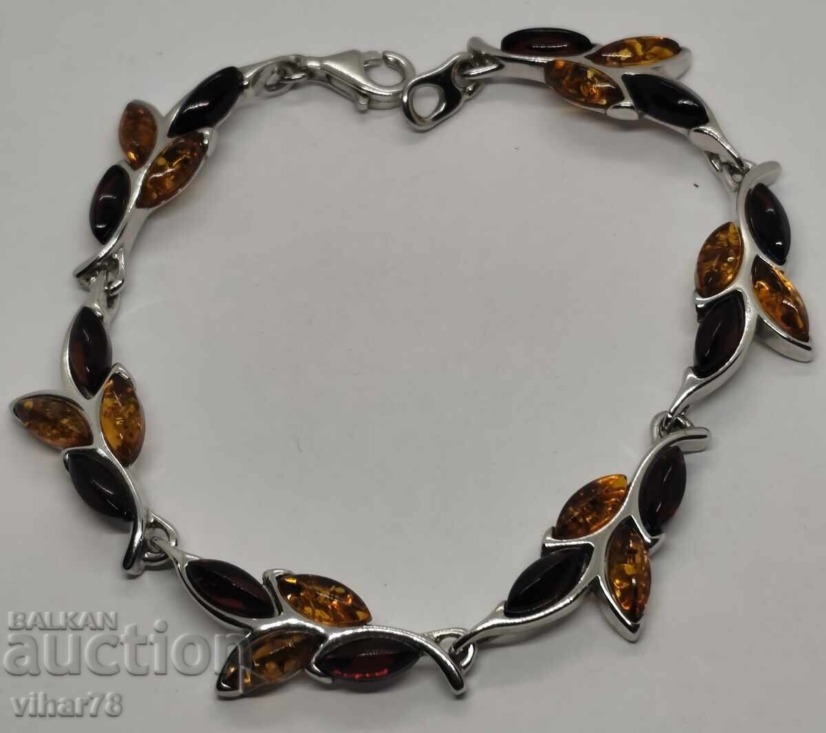 Licitație Brățară de argint cu granat și chihlimbar Licitație Brățară de argint cu granat și chihlimbar