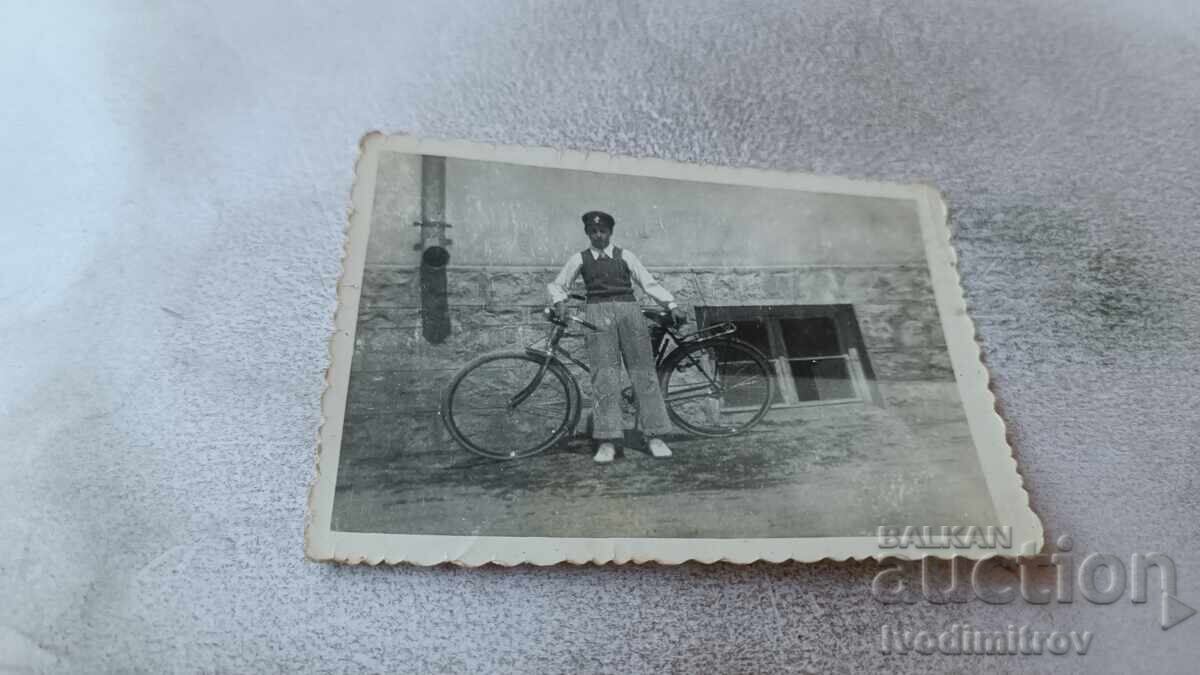 Photograph of Long-Termers Boy with retro bicycle on the street 1955
