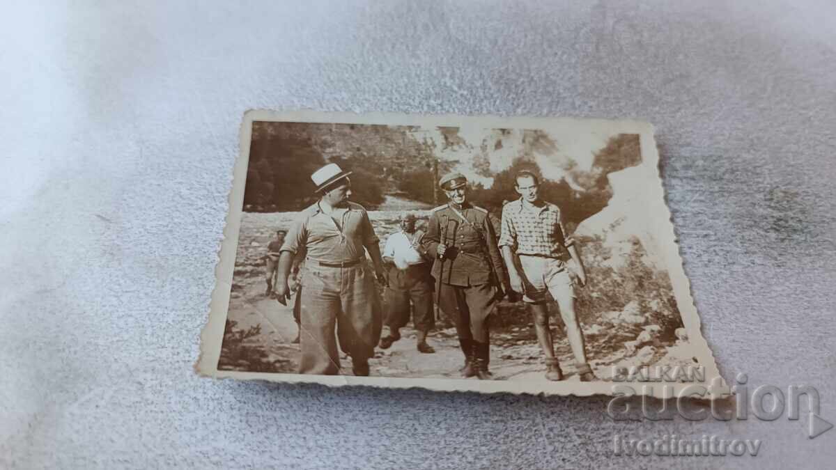 Photo of Officer and men on a walk