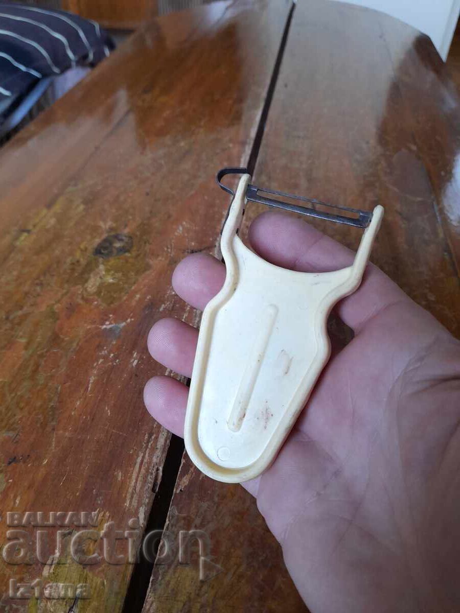 Auction  Old Triumph fruit and vegetable peeler