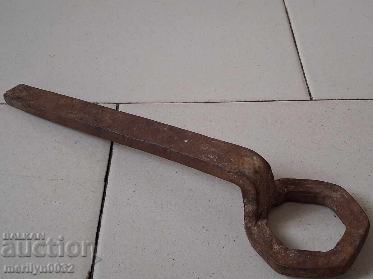 Old forged key from a blacksmith's workshop for a cart Old forged key from a blacksmith's workshop for a cart