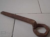 Old forged key from a blacksmith's workshop for a cart