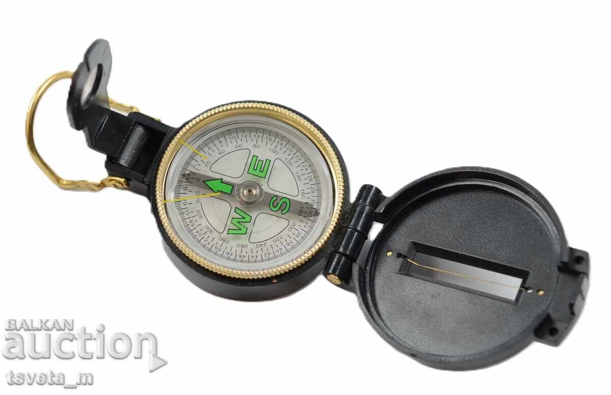 Compass with fluorescent markings Compass with fluorescent markings