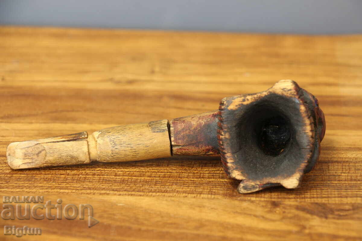 Delivery of Strange Old Wooden Pipe with Indian Motif
