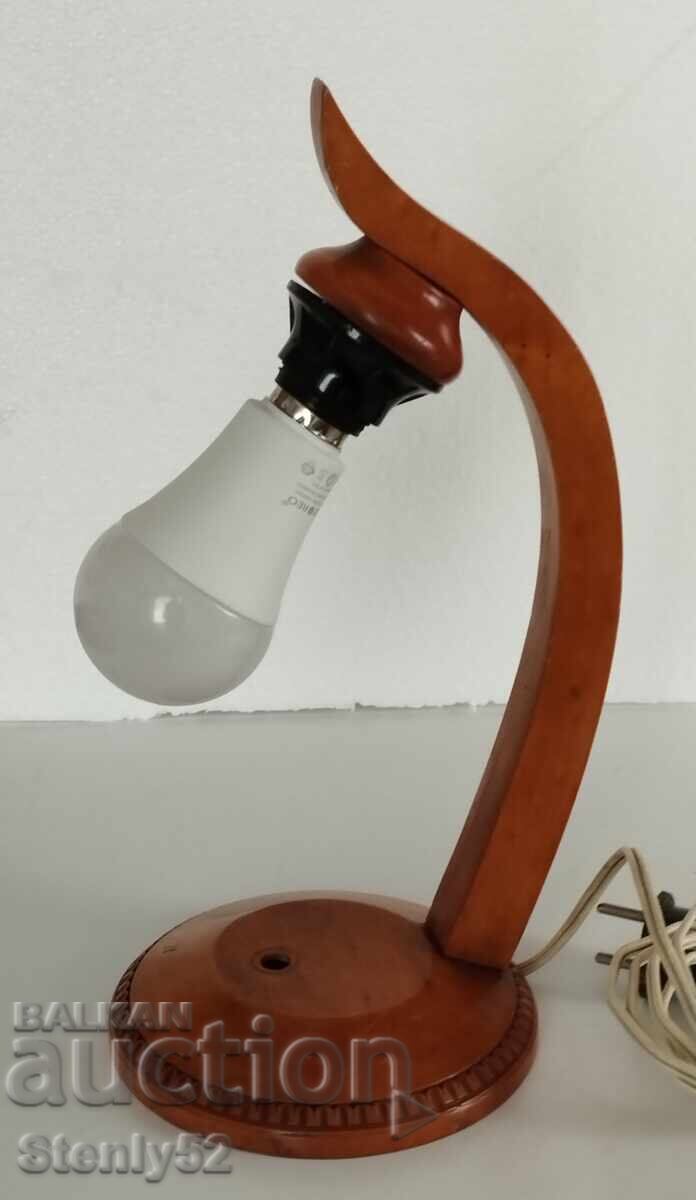 Old night lamp on a wooden base Old night lamp on a wooden base