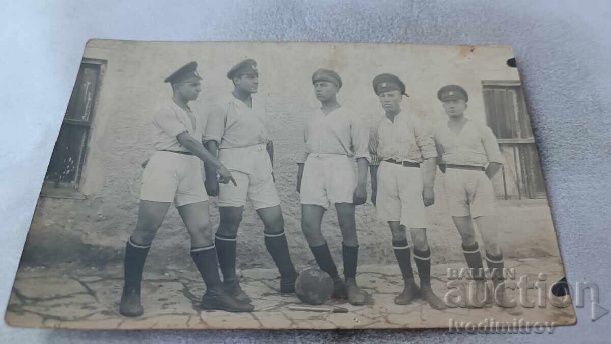 Photo Sliven Soldiers in sports uniforms with retro football ball