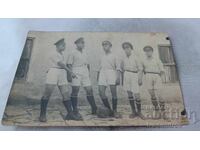 Photo Sliven Soldiers in sports uniforms with retro football ball