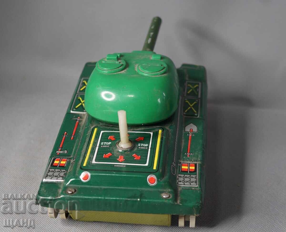 Delivery of Old metal toy tank model, battery operated