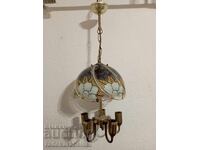 Beautiful chandelier with a glass lampshade