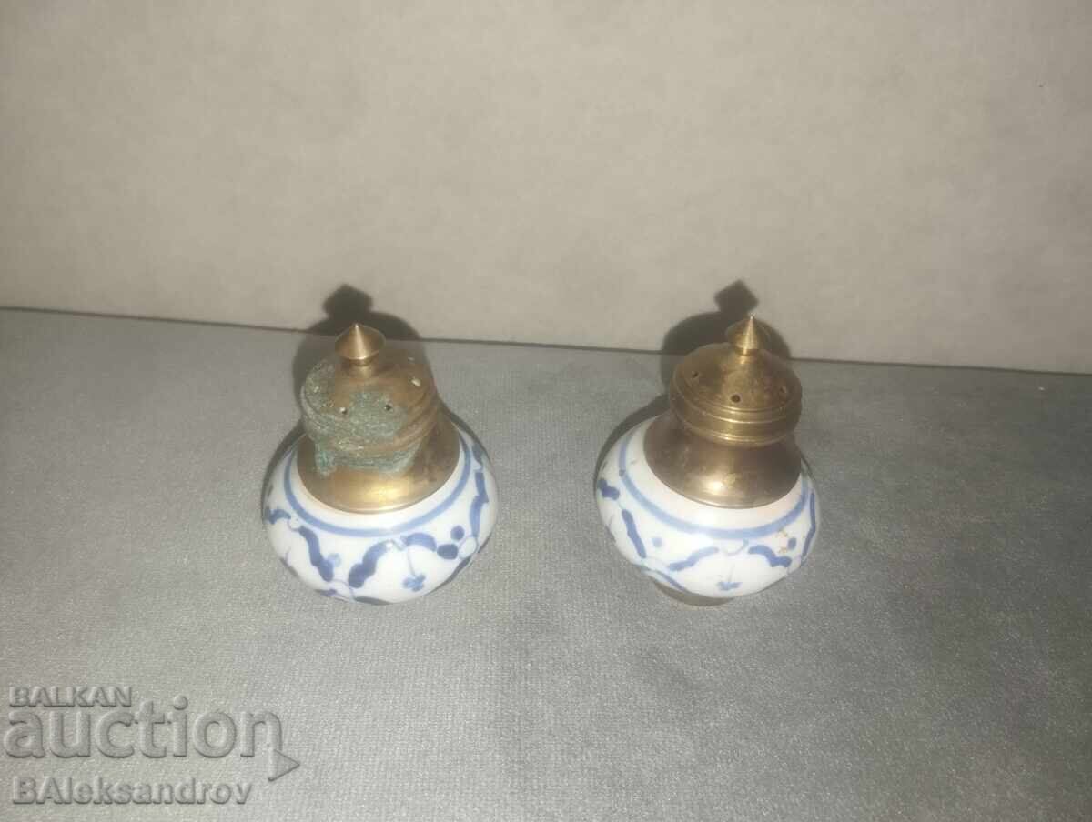 Two porcelain salt shakers with brass ornaments with price 21.00 BGN | € 10.74