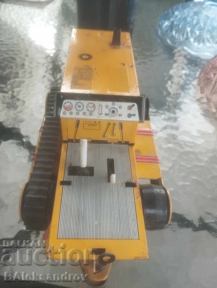 Delivery of Old tin toy bulldozer Delivery of Old tin toy bulldozer