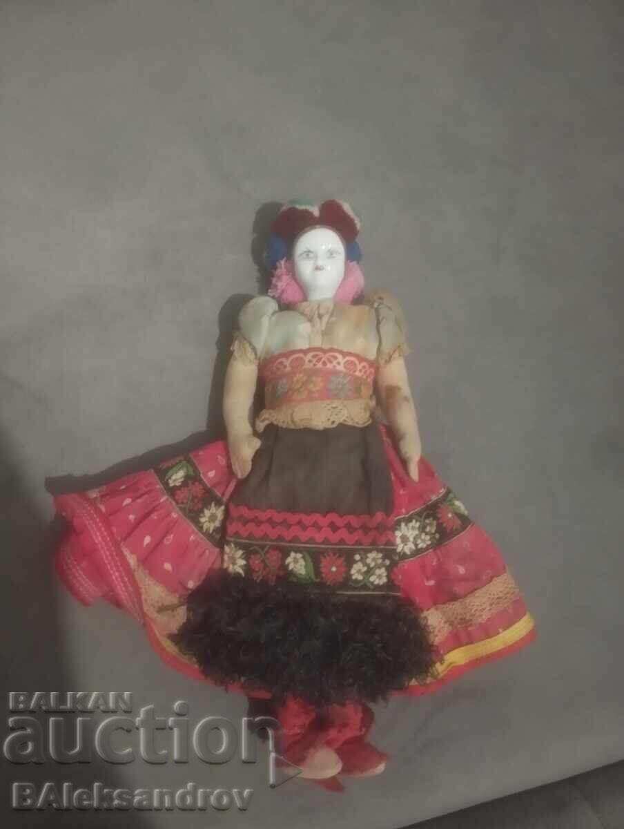 Old rag doll with a porcelain head Old rag doll with a porcelain head