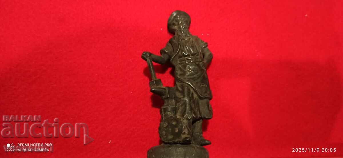 Old bronze miniature of a blacksmith, very beautiful and delicate Old bronze miniature of a blacksmith, very beautiful and delicate