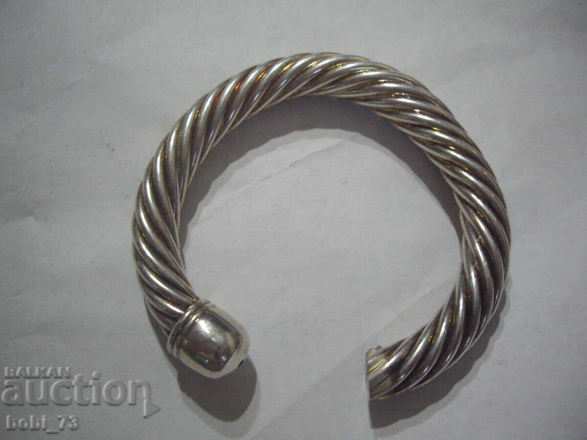 Part of a massive silver bracelet Part of a massive silver bracelet