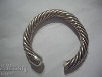 Part of a massive silver bracelet