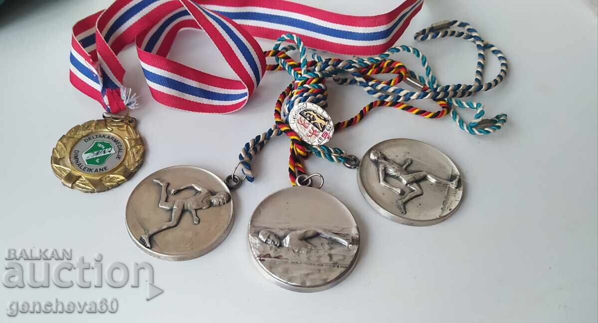 Old sports medals and badge