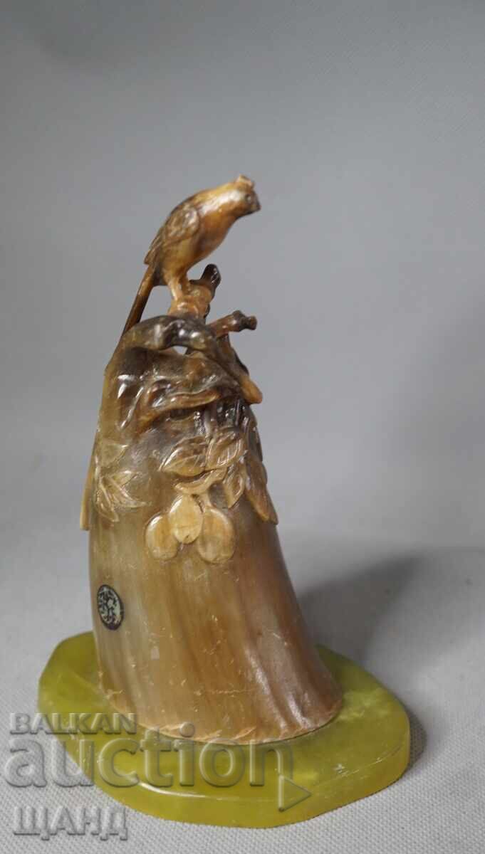 Old figurine statuette bird on stone Old figurine statuette bird on stone