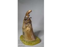 Old figurine statuette bird on stone