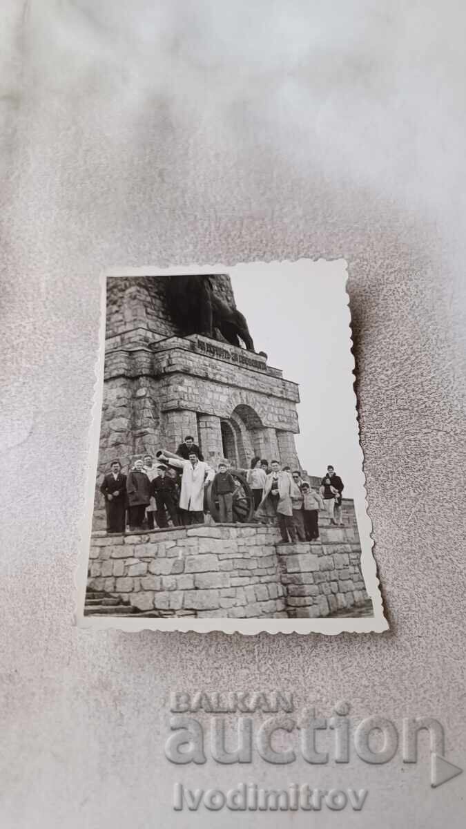 Photo Men and children in front of Shipka Monument on Stoletov Peak Photo Men and children in front of Shipka Monument on Stoletov Peak