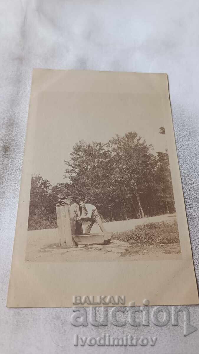 Photograph of an Officer Washing at the Tap, World War I