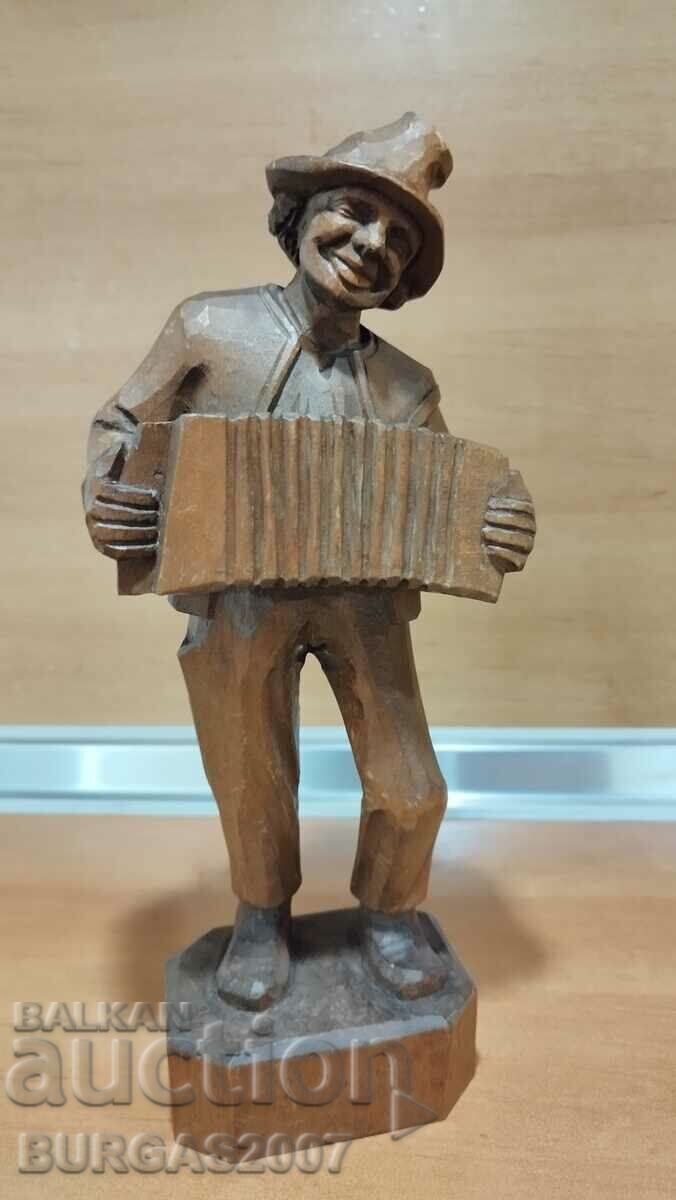 Auction  Old wooden figure, musician with accordion, 29 cm.