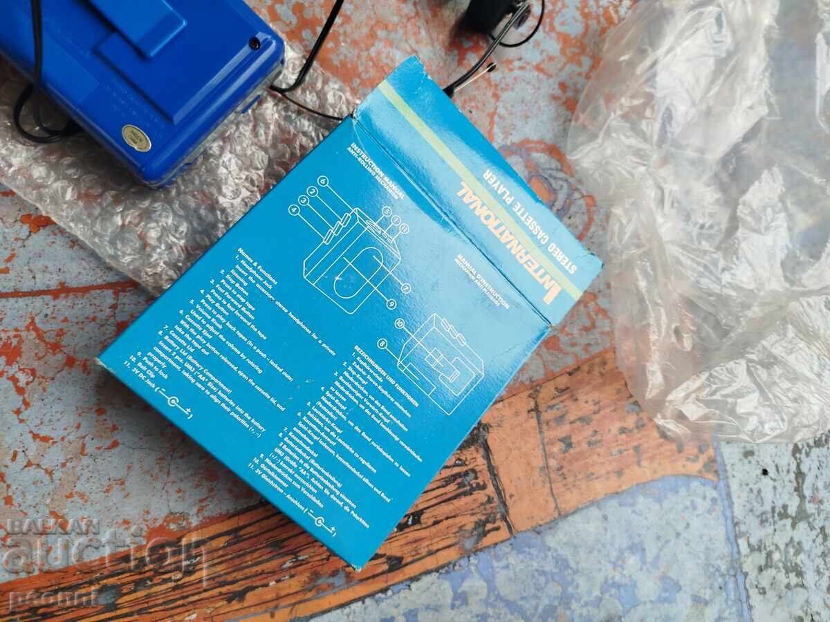 Auction  Brand new international Walkman and headphones