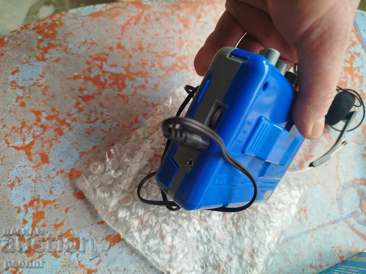 Delivery of Brand new international Walkman and headphones