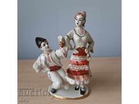 Old Bulgarian porcelain figure statuette, young people in traditional costumes