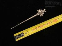 Revival-era carved needle