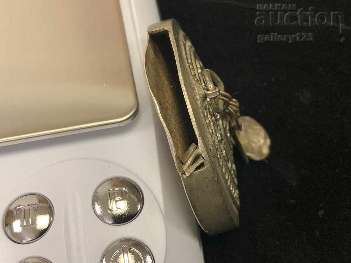 Delivery of Revival-era silver carved amulet Delivery of Revival-era silver carved amulet