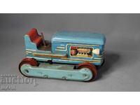 Old metal toy tractor model, battery-operated