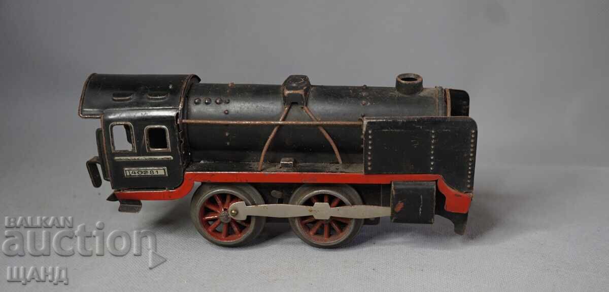 Παλιό Γερμανικό Μεταλλικό μηχανικό παιχνίδι τρένο ατμομηχανή με τιμή 40.35 BGN | € 20.63