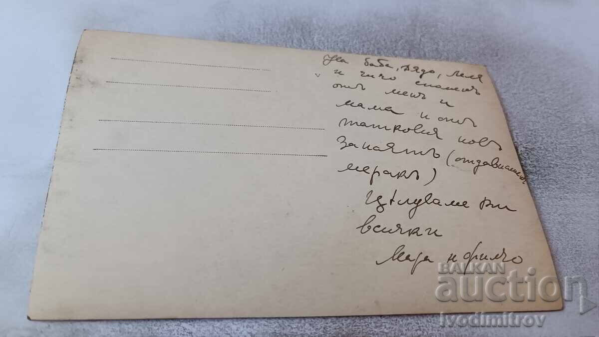 Photo of a Woman and Boy with a Retro Gramophone and Sewing Machine on a Table with price 2.45 BGN | € 1.25 Photo of a Woman and Boy with a Retro Gramophone and Sewing Machine on a Table with price 2.45 BGN | € 1.25