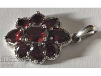 Silver pendant with garnet