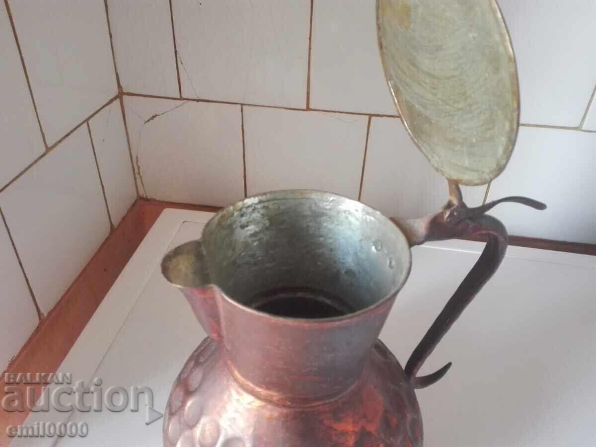 Auction  Old copper jug.