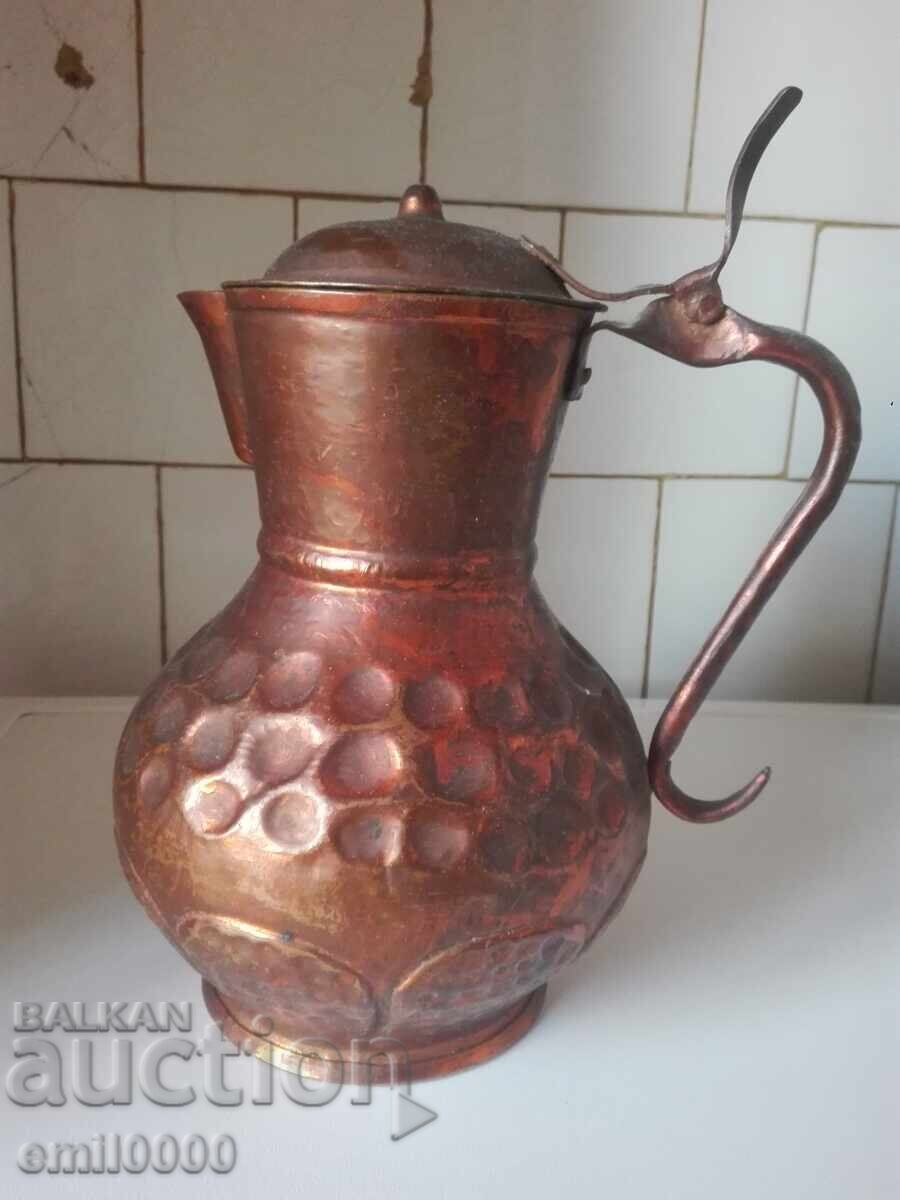 Old copper jug.