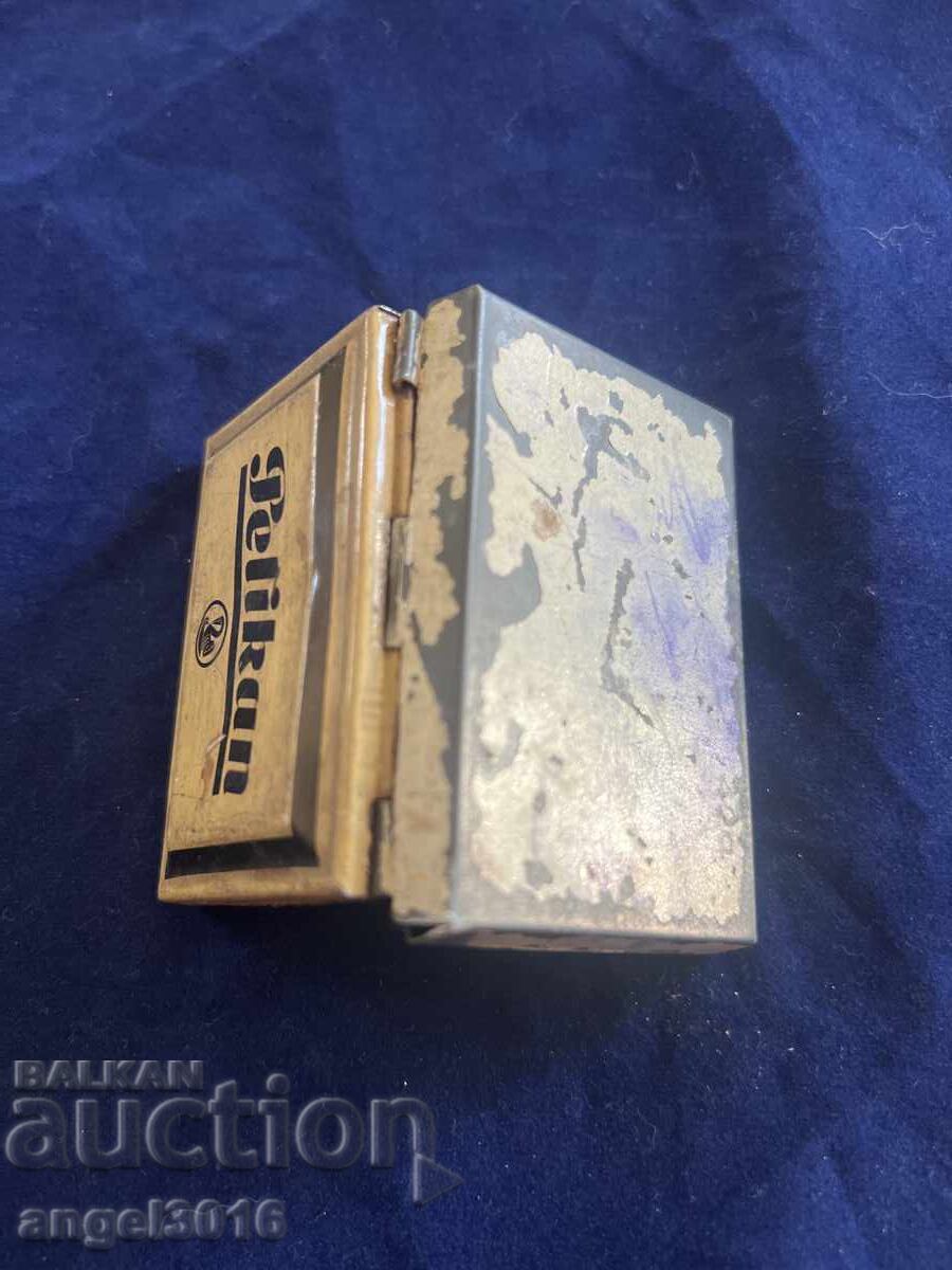 Auction  Old vintage Pelikan stamp pad in a metal case