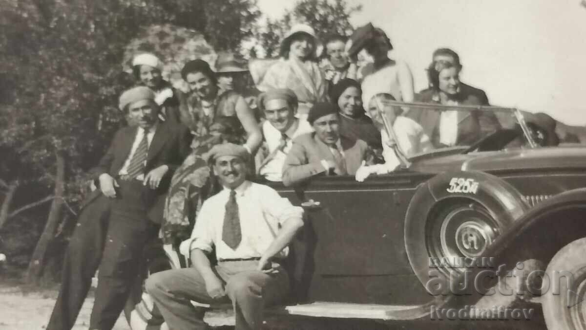 Photo of men and women with a retro car with license plate TV 256 with price 6.45 BGN | € 3.30