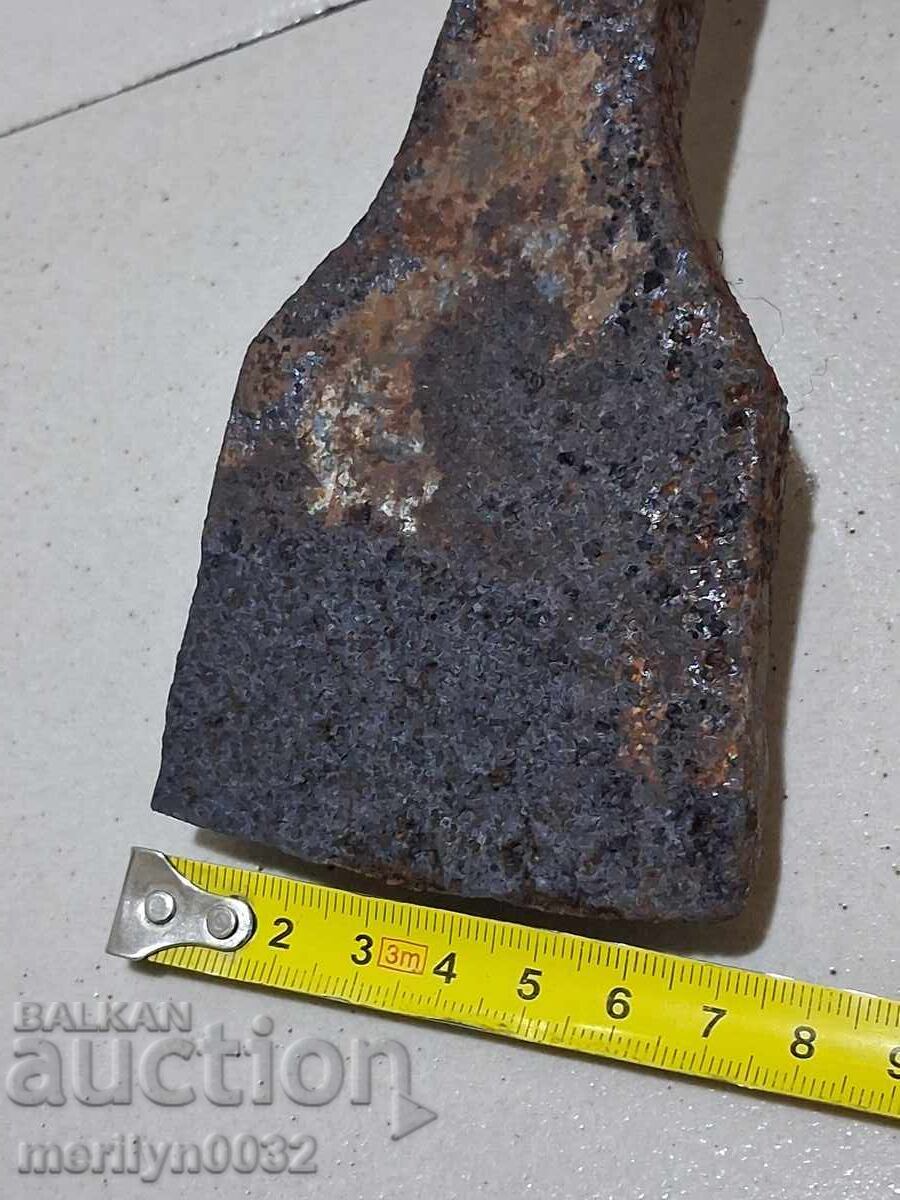 Delivery of Old hand-forged pickaxe tool wrought iron