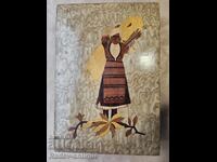 Old Bulgarian wooden box with a reaper from the 1930s