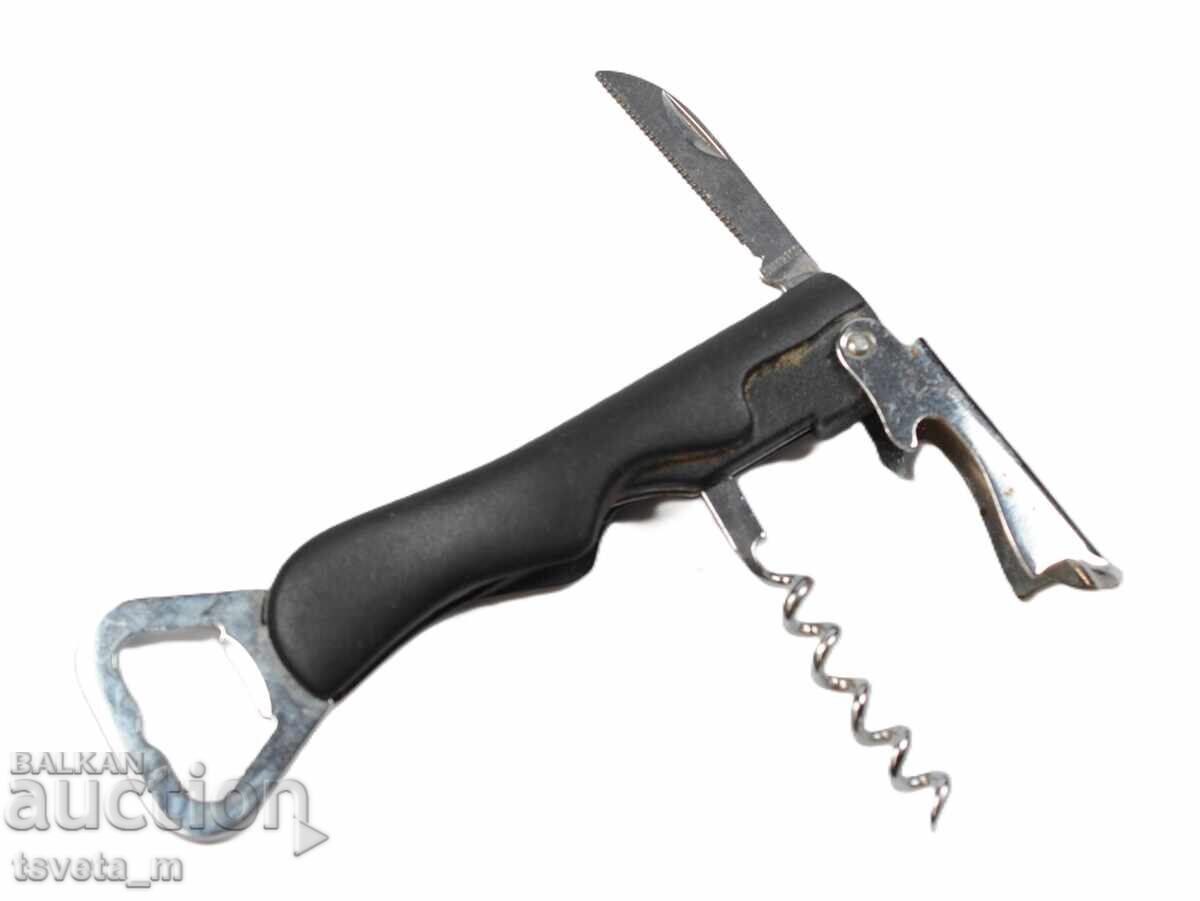 Auction  Corkscrew with two bottle openers and a small knife