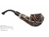 Antique pipe decorated with metal ornaments