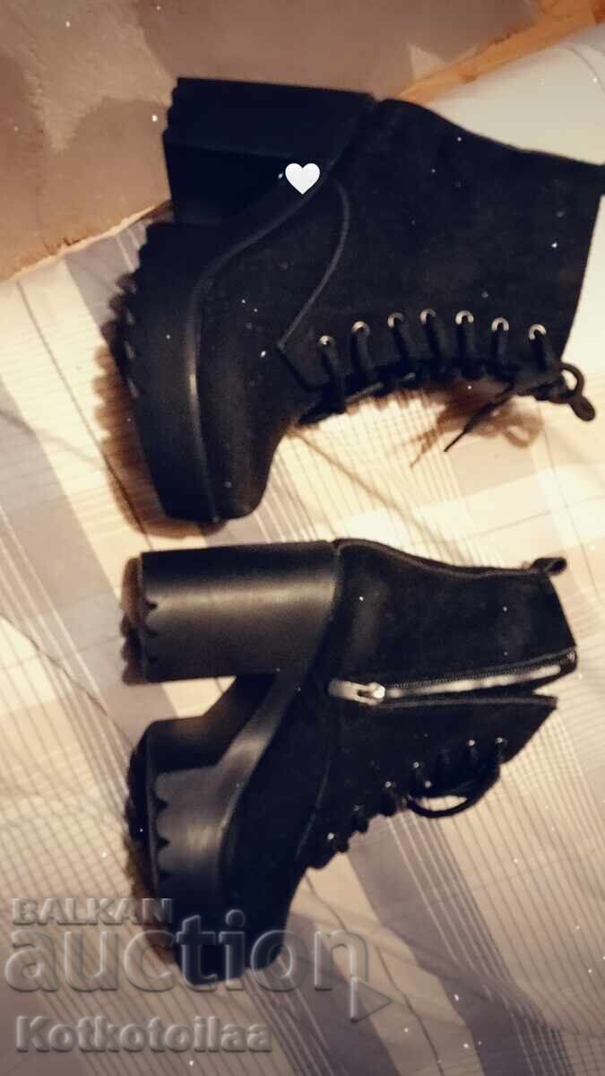 Delivery of Black boots (brand new)