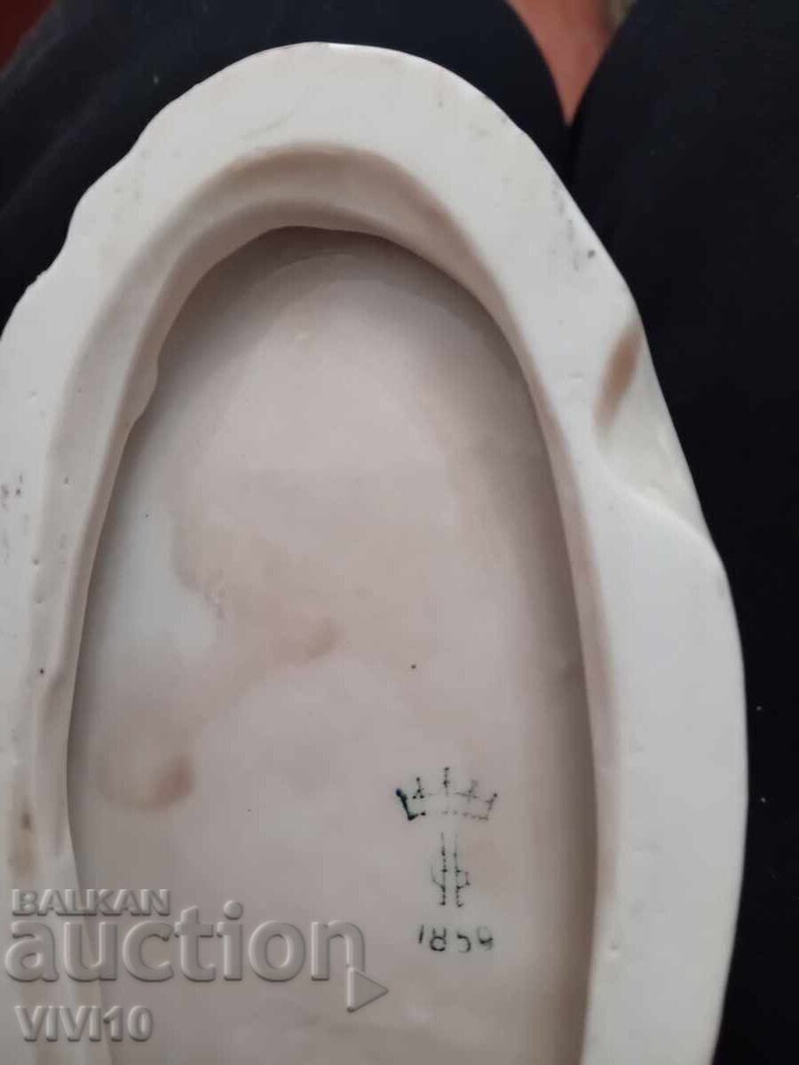 Auction  Antique porcelain figure, marked