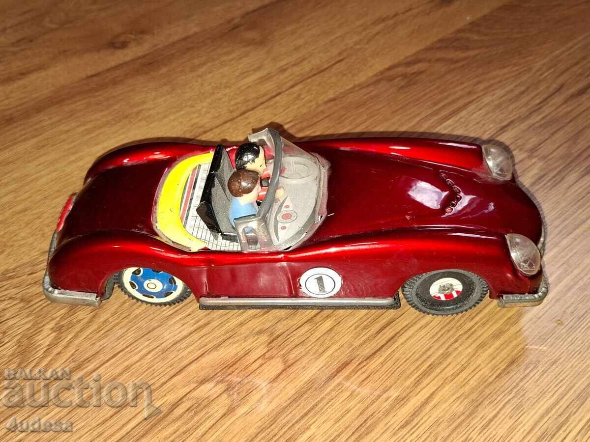 Auction  Made in China old tin car with an inertial mechanism