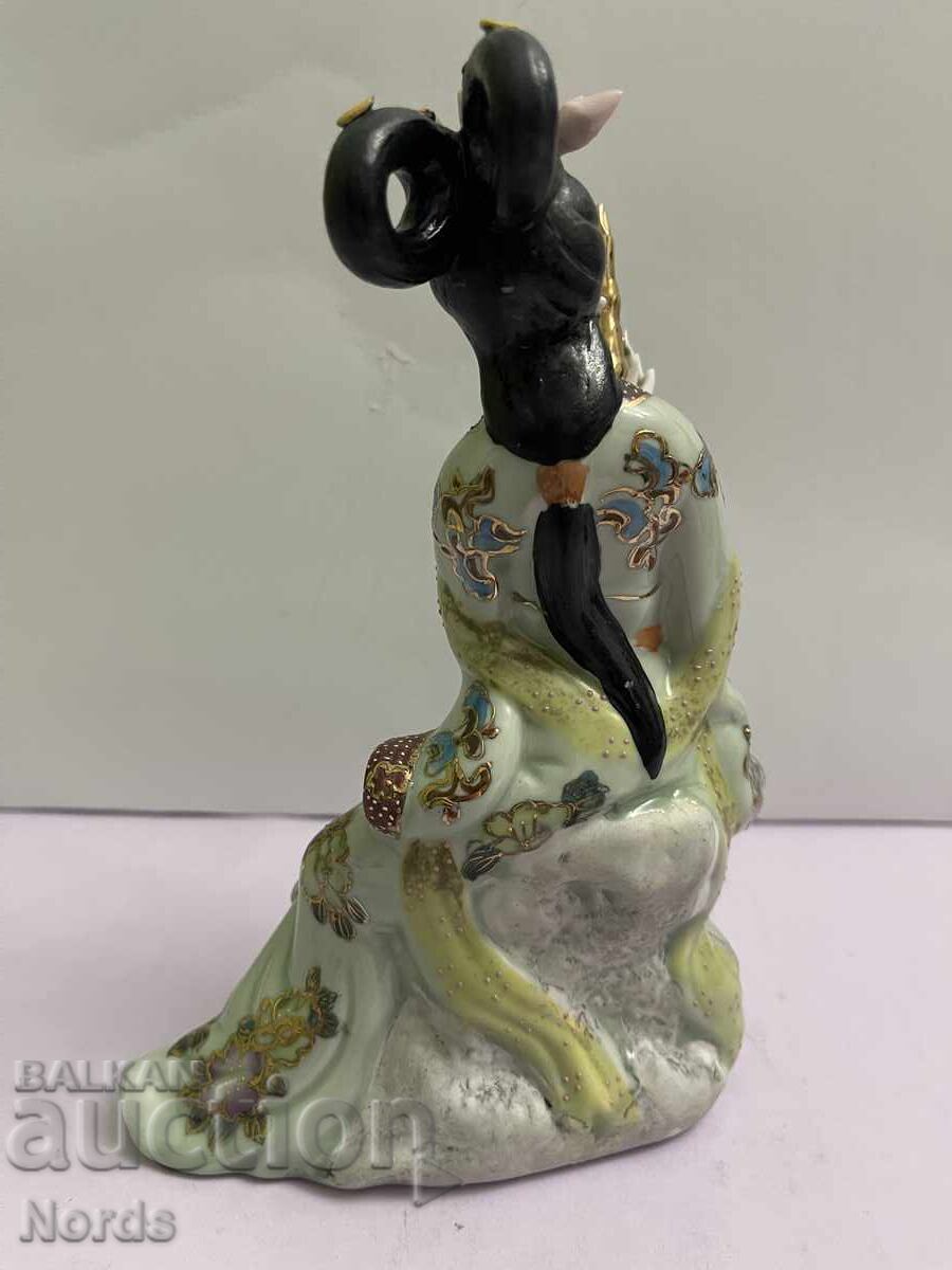 Auction  Porcelain figurine with markings