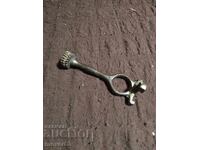 Old weapon manual. Extractor. Brass